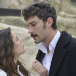 A man and woman face each other outdoors in a scene from Halef Episode 23.