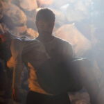 Two figures stand in a dim, smoky setting in a scene from Halef Episode 24.