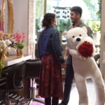 A man, woman and child stand together indoors in a still from Halef: Köklerin Çağrısı Episode 12.