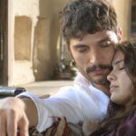A man and woman share an interior scene in Halef: Köklerin Çağrısı Episode 11.